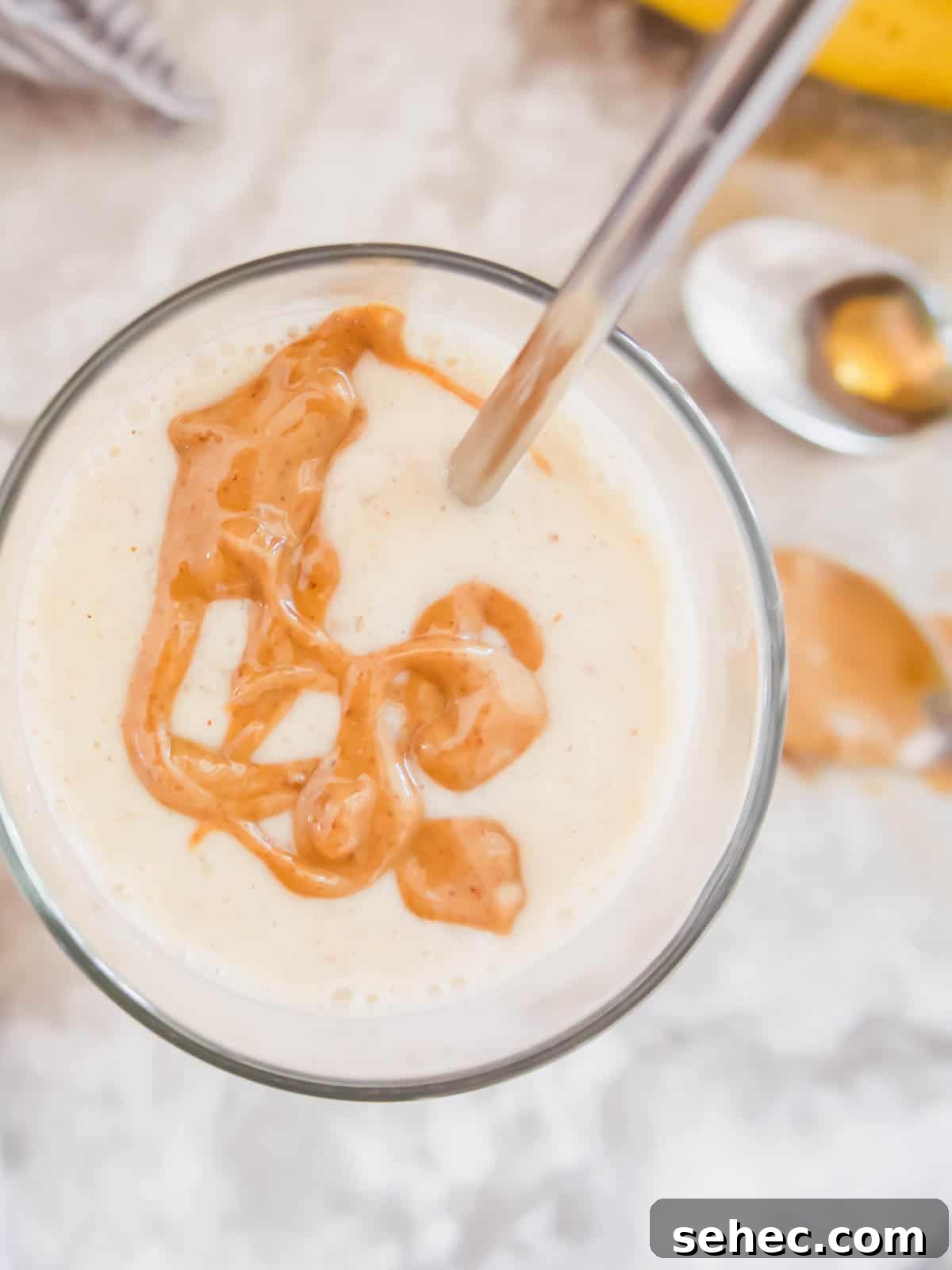 Maple Banana Yogurt Smoothie 3 Banana smoothie with yogurt with almond butter drizzled on top.