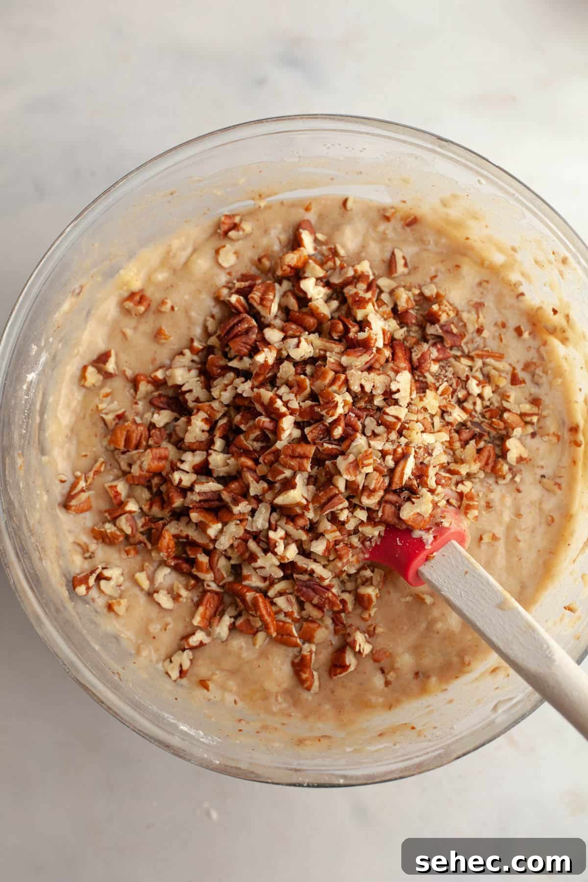 One Bowl Brown Butter Cinnamon Banana Bread with Pecans 7 Banana bread batter with chopped pecans.