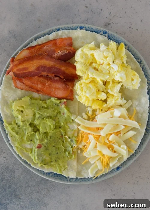 Bacon Egg and Cheese Tortilla Breakfast Wrap 3 Ingredients arranged for a bacon egg and cheese tortilla breakfast wrap.