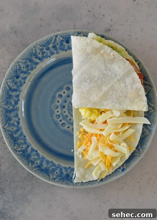 Bacon Egg and Cheese Tortilla Breakfast Wrap 5 Scrambled eggs and bacon prepared for a keto breakfast tortilla.