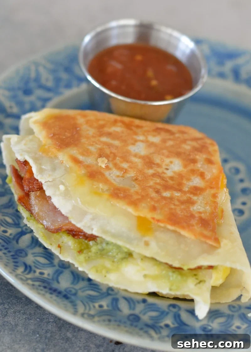 Bacon Egg and Cheese Tortilla Breakfast Wrap 7 Golden toasted bacon egg and cheese tortilla breakfast wrap.