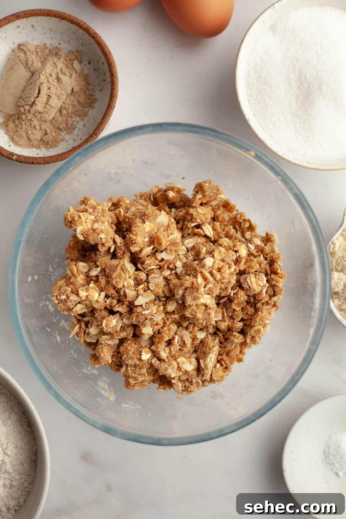 Brown Butter Cardamom Almond Cake Recipe 5 An oat streusel in a small glass bowl.