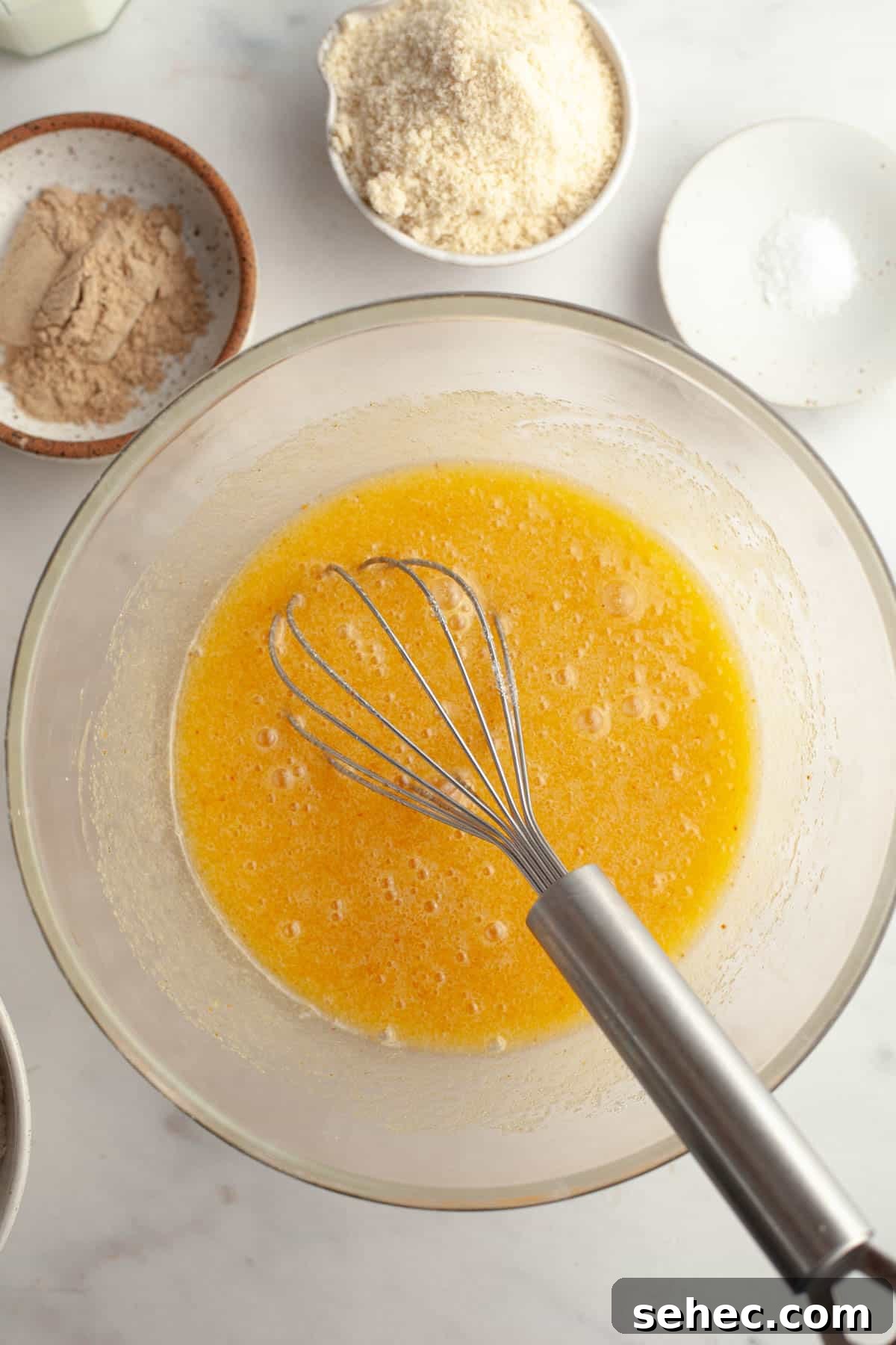 Brown Butter Cardamom Almond Cake Recipe 6 A large glass bowl with melted butter, sugar and eggs.
