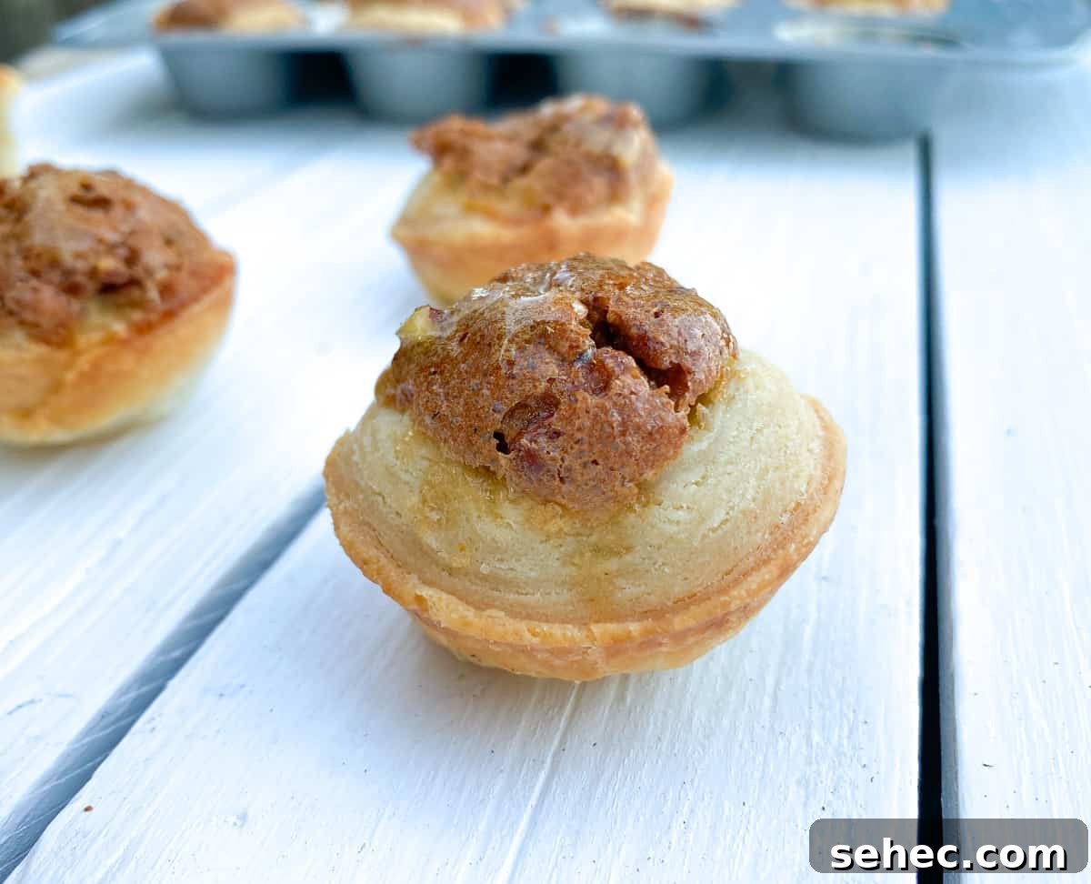 19 Big Batch Cookie Recipes for Parties and Crowds 21 pecan tassie tart cookies on table.