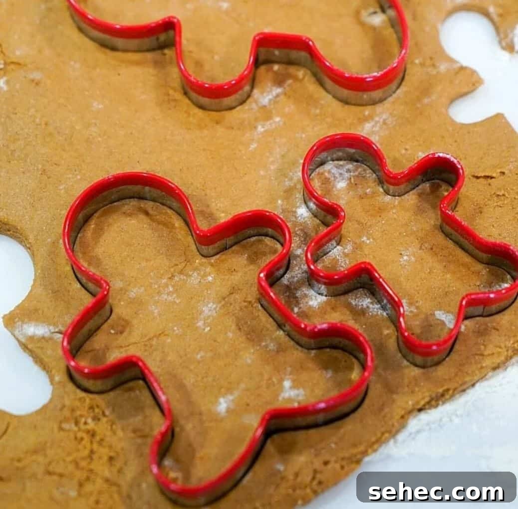 19 Big Batch Cookie Recipes for Parties and Crowds 5 Gingerbread cookie dough with red cookie cutters.