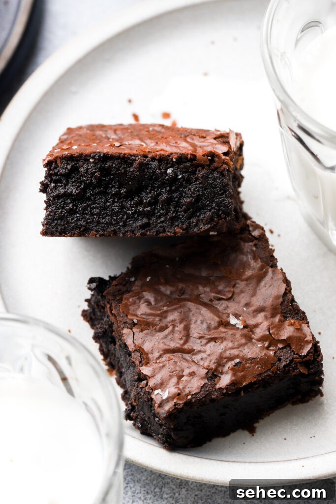Fudgy Brown Butter Brownies with Crackly Tops 4 two brown butter brownies on a plate