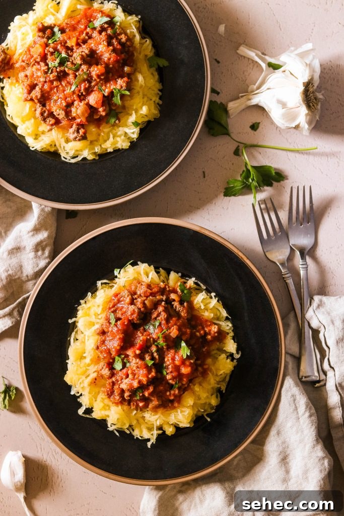 Instant Pot Spaghetti Meat Sauce for Paleo Whole30 4 Whole30 meat sauce recipe served on 2 plates over spaghetti squash