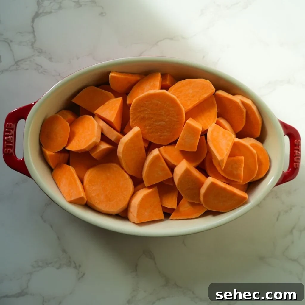 Southern Candied Yams with Brown Sugar and Butter 5 Peeled & cut sweet potatoes in a baking dish.