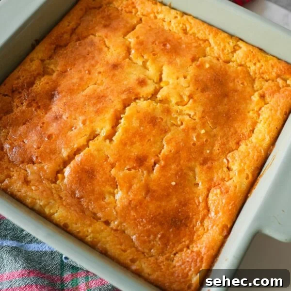 Southern Candied Yams with Brown Sugar and Butter 10 Corn casserole baked in a dish with a golden top and a soft, moist center.