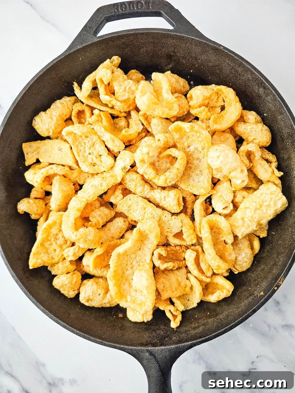 Cast Iron Skillet Pork Rind Nachos 8 Pork rinds in a cast iron skillet