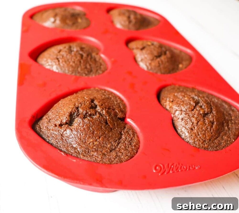 25 High Protein Low Carb Breakfast Ideas for Busy Mornings 14 Keto Chocolate Flaxseed Muffins in red heart silicone baking pan side view