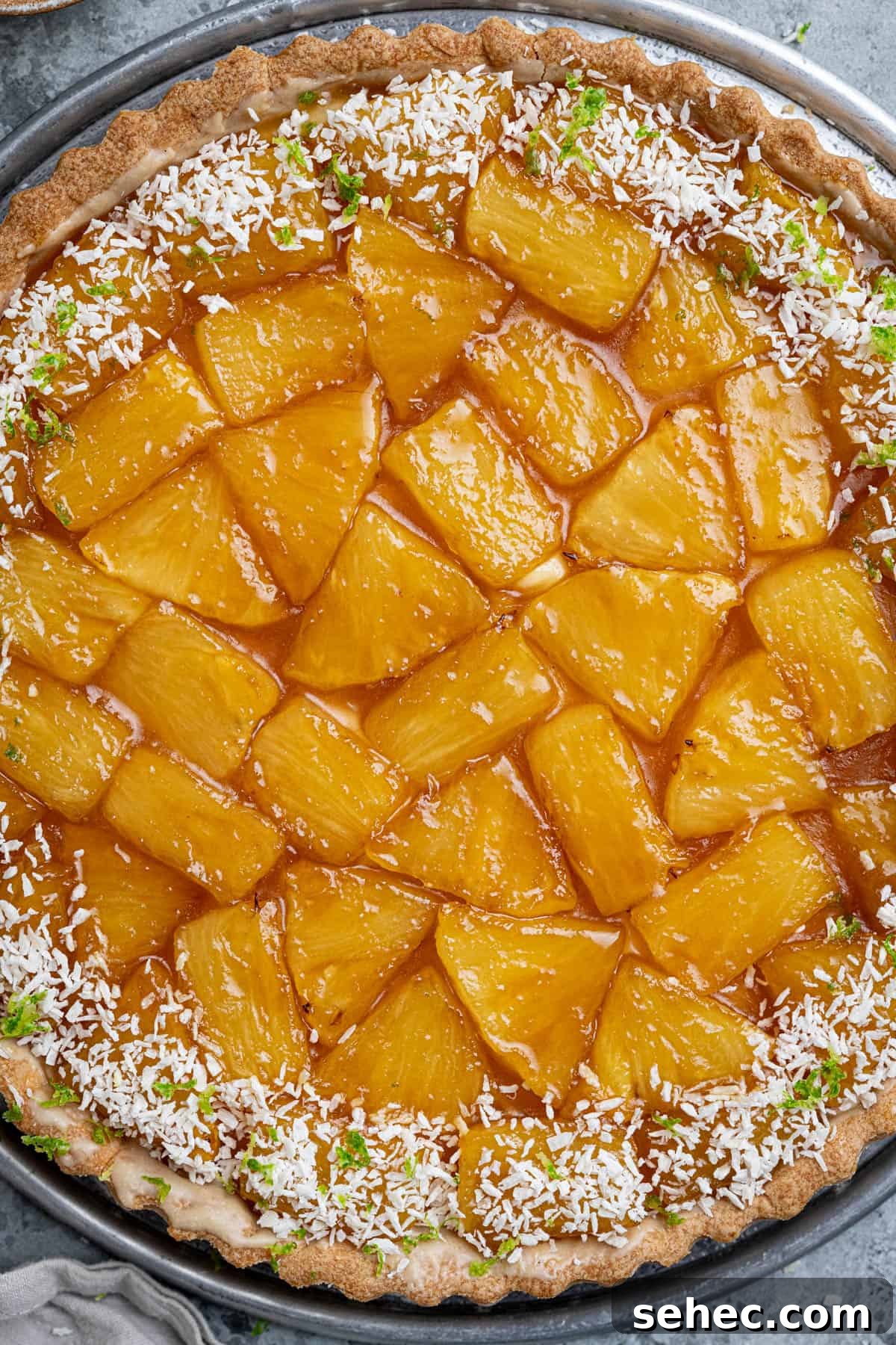 Vegan Caramelized Pineapple Coconut Tart 16 Close-up of caramelised pineapple on top of the tart.