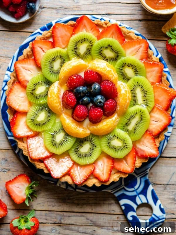 Ricotta and Sour Cherry Crostata 8 An overhead shot of a fruit tart layered with fresh fruit