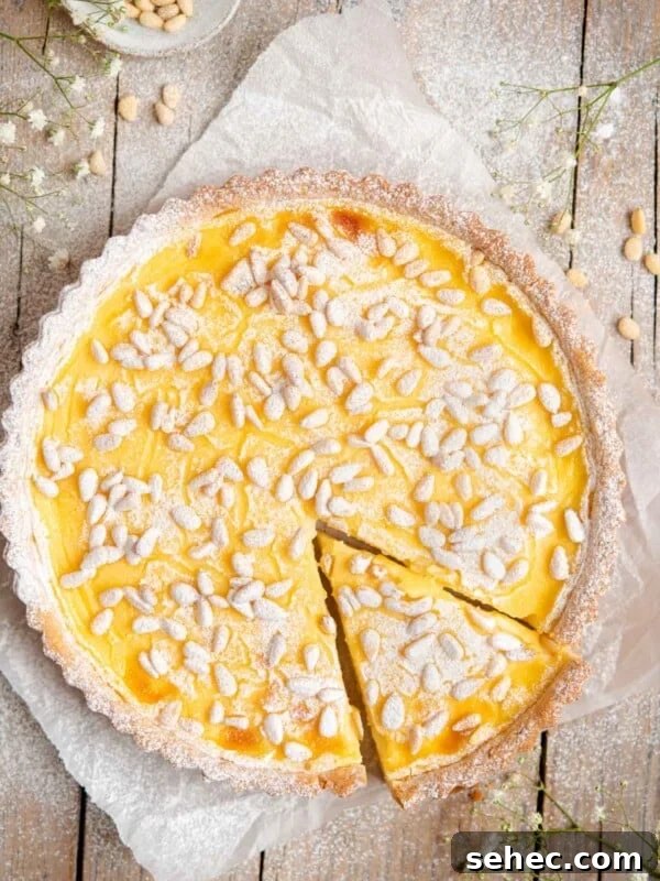 Ricotta and Sour Cherry Crostata 10 An overhead shot of torta della nonna on a rustic wooden surface