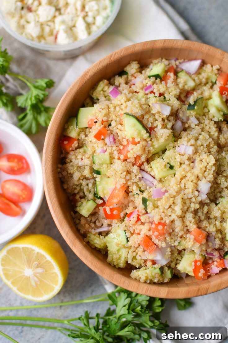 Make-Ahead Quinoa Party Salad - Easy recipe for a light Greek-inspired salad with cucumbers, peppers and onions. YUM. - ProjectMealPlan.com