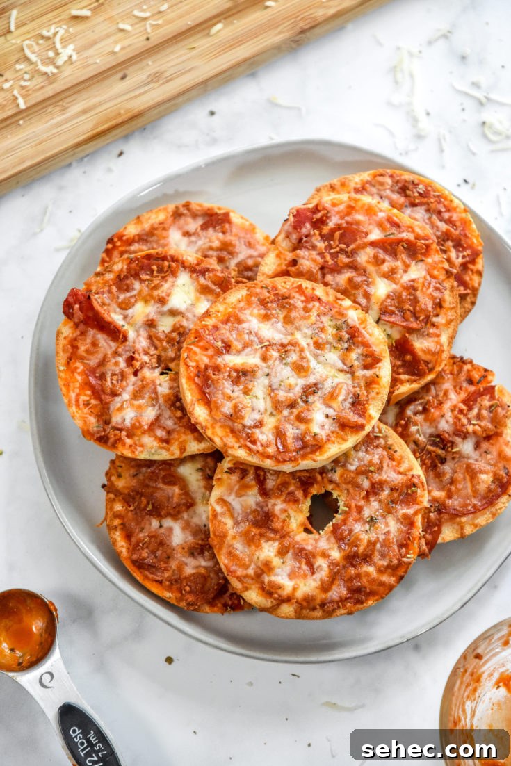 stack of just cooked air fryer homemade pizza bagel bites on a plate.
