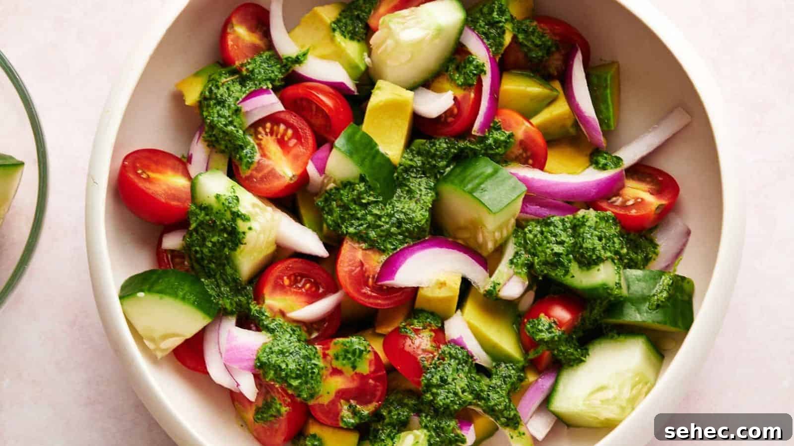 17 Budget Cookout Recipes That Save Room for Better Burgers 12 Avocado salad with dressing in a serving bowl.