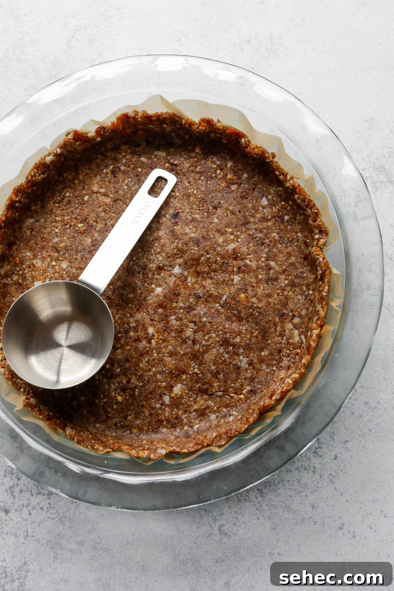 Vegan Dark Chocolate Pecan Pie Recipe 5 Grain-Free Crust in pie pan with parchment paper by Flora & Vino