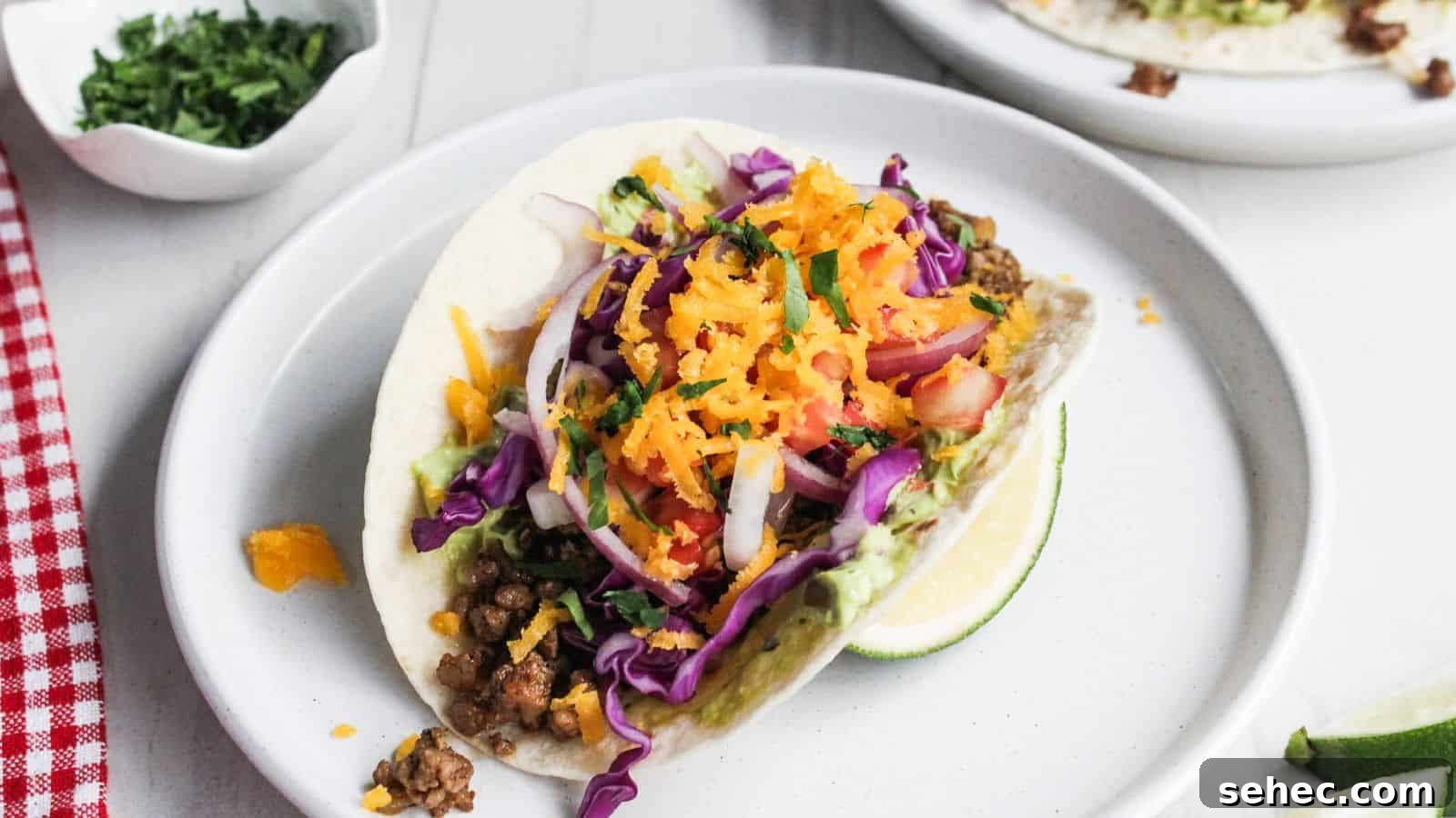 19 Weeknight Dinner Recipes You’ll Want to Cook Again 2 An easy dish to look forward to cooking every night: a colorful taco with ground meat, shredded carrots, red cabbage, and a slice of lime on the side.