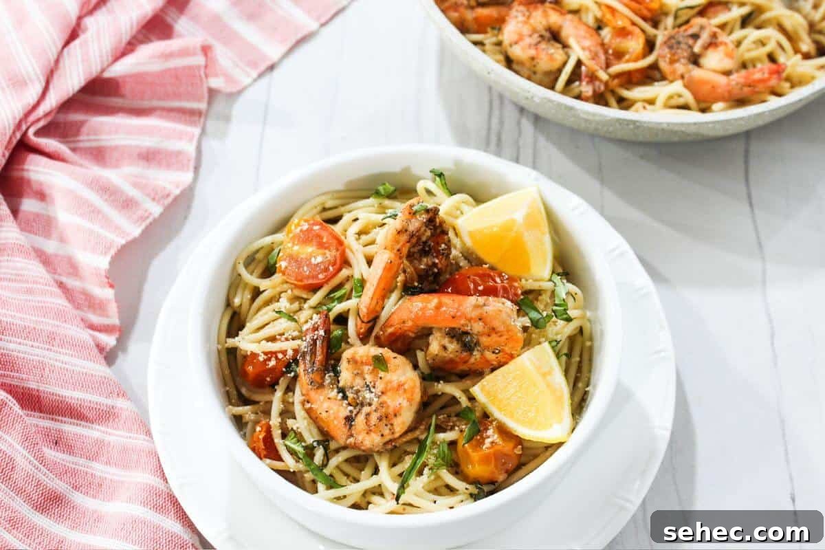 19 Weeknight Dinner Recipes You’ll Want to Cook Again 13 A bowl of pasta with shrimp and tomatoes.