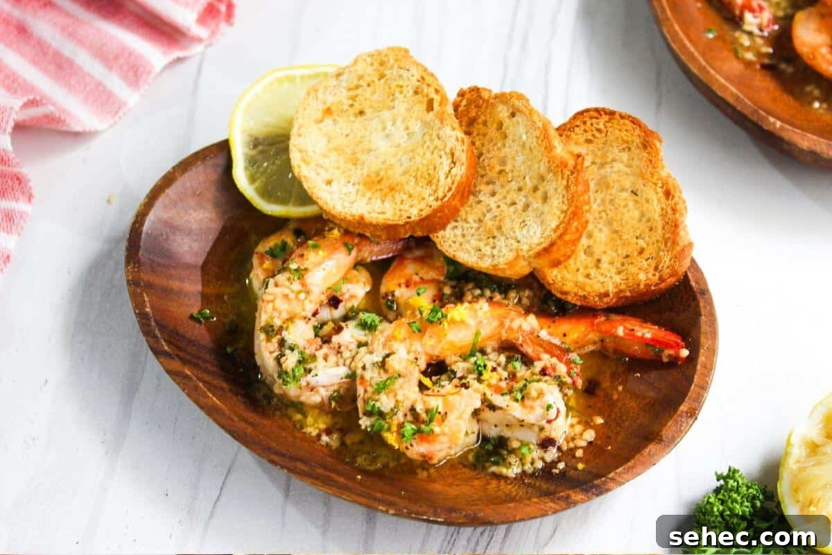 19 Weeknight Dinner Recipes You’ll Want to Cook Again 21 A plate with shrimp and bread on it.