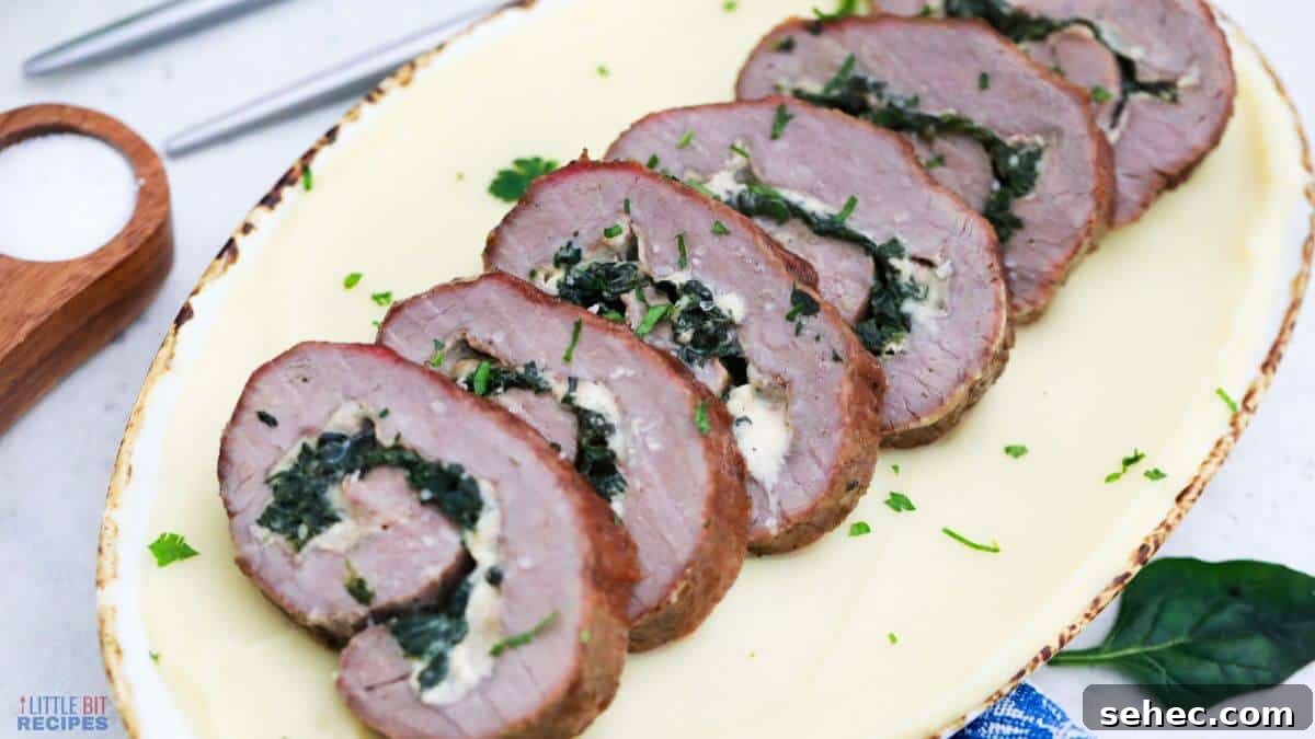 19 Weeknight Dinner Recipes You’ll Want to Cook Again 4 Stuffed steak pinwheels sliced on platter.