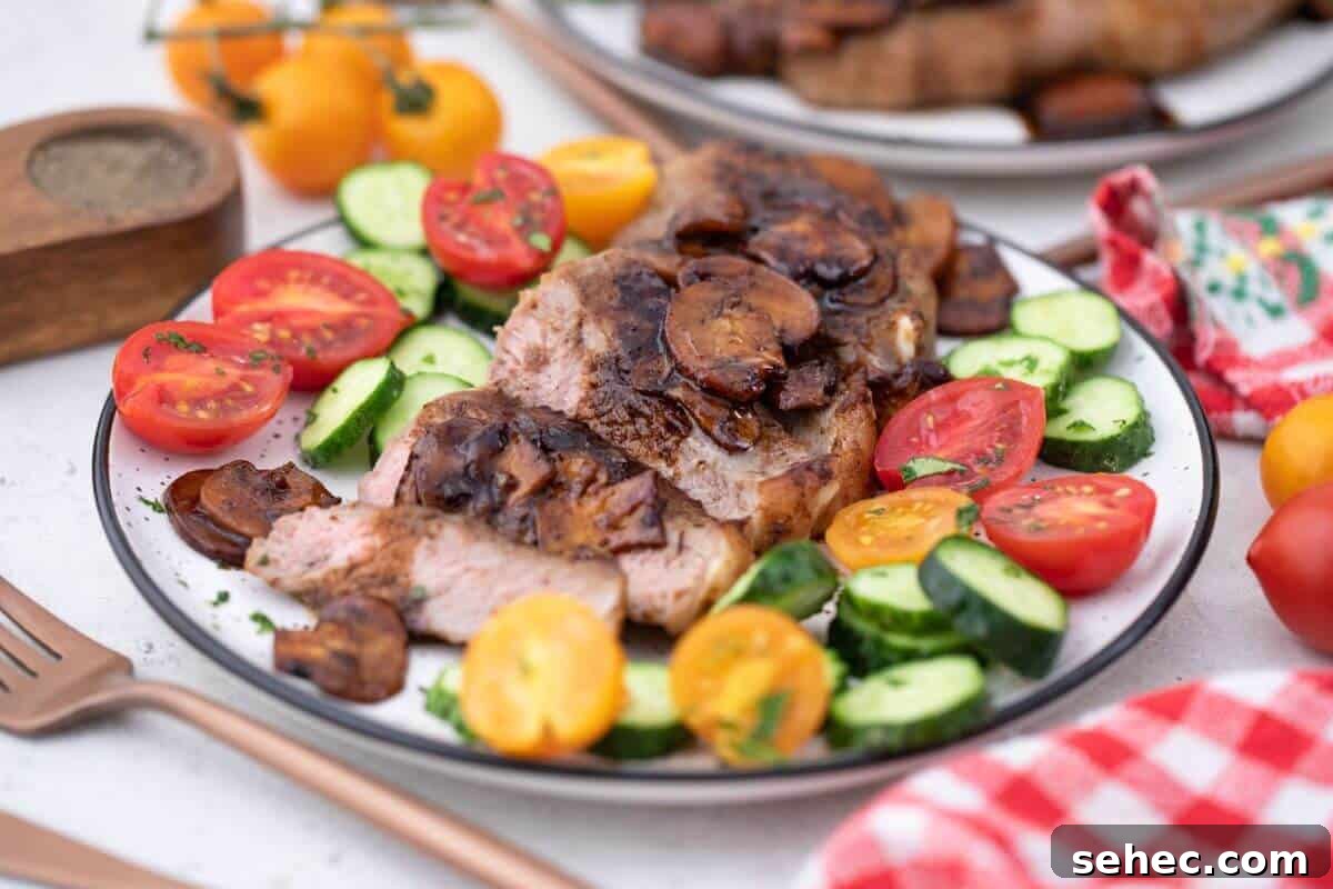 19 Weeknight Dinner Recipes You’ll Want to Cook Again 6 A plate with steak, tomatoes and cucumbers on it.