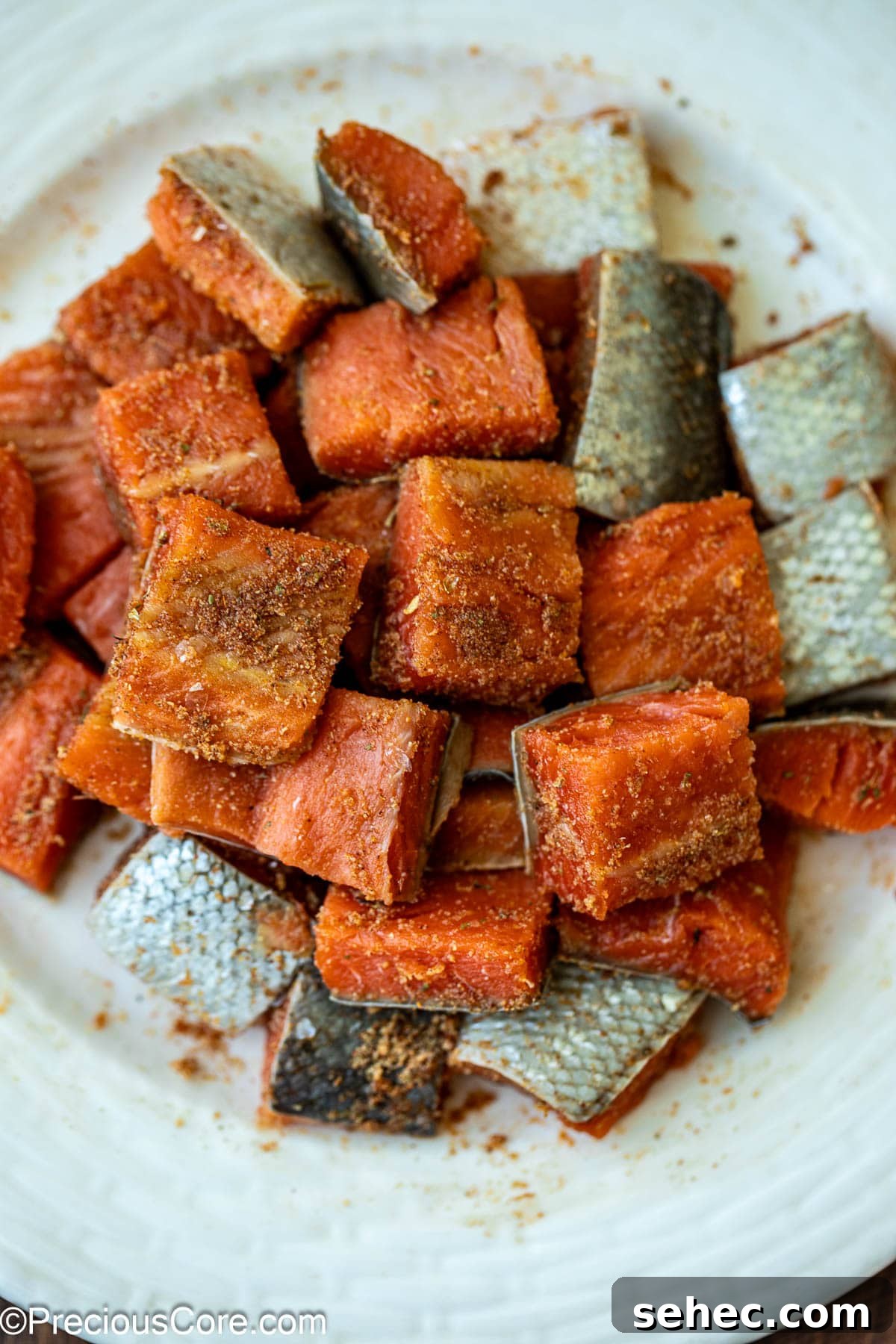 Creamy Cajun Salmon Pasta 7 Raw salmon seasoned with spices.