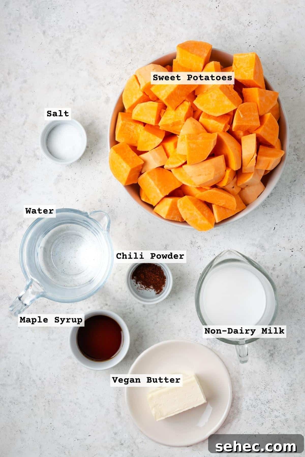 Creamy Instant Pot Mashed Sweet Potatoes 3 Ingredients for mashed sweet potatoes on a white table.