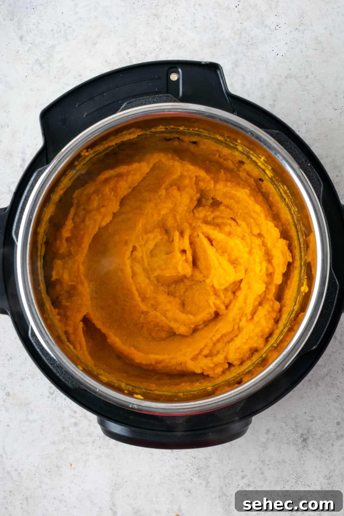 Creamy Instant Pot Mashed Sweet Potatoes 7 Whipped sweet potatoes sitting in an Instant Pot.