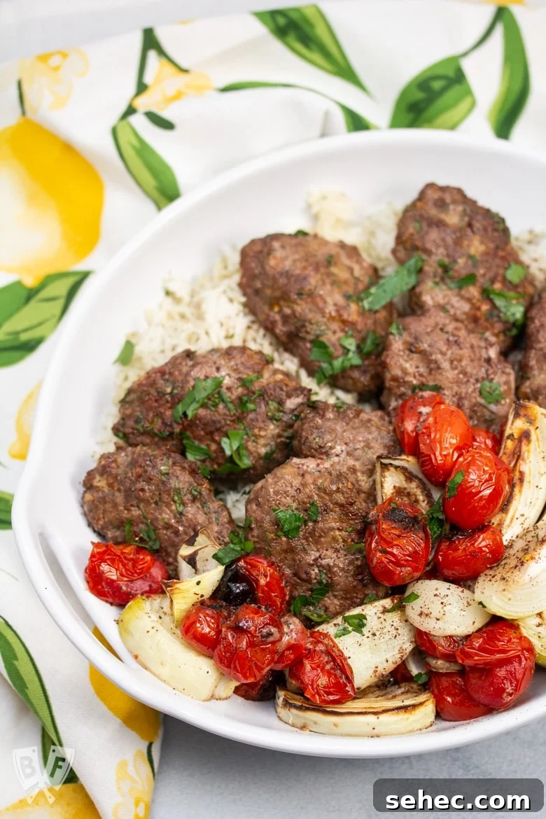 Sheet Pan Chicken Kebabs with Vegetables 8 Overhead view of Broiler Kebab Sheet Pan Meal served in a bowl over rice