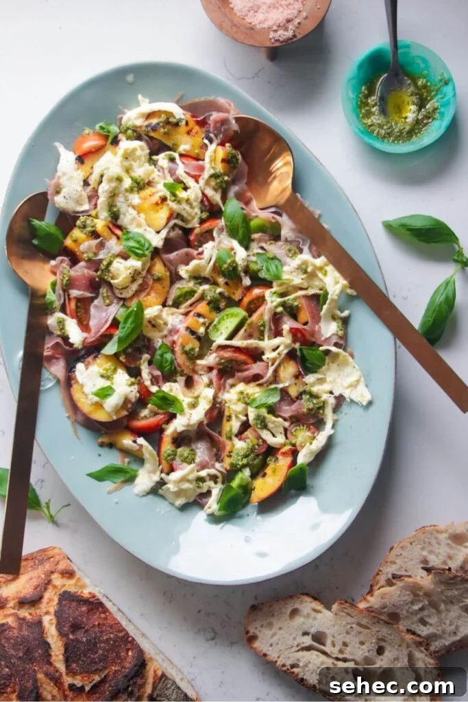 Crispy Smashed Potato Salad with Tzatziki Sauce 15 Grilled peach, burrata, tomato salad on a large blue serving platter.