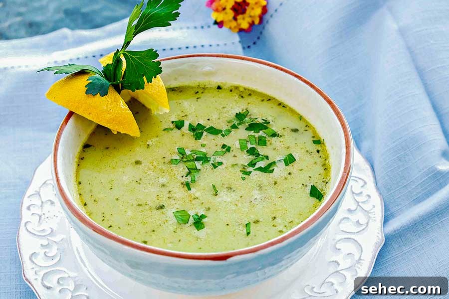 vegetarian chickpea parsley soup in a bowl with lemon wedges
