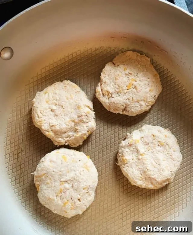 Low Carb Old Bay Tuna Cakes Recipe 7 fry tuna cakes on stove