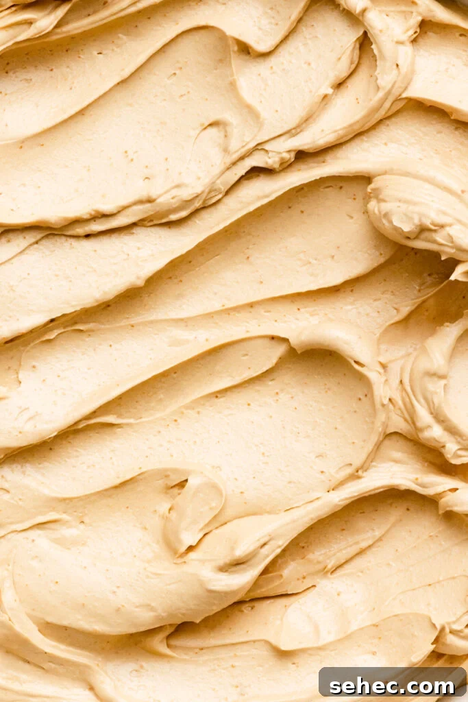 Brown Butter Buttercream Frosting Recipe 2 Close up of brown butter frosting smeared in a bowl.