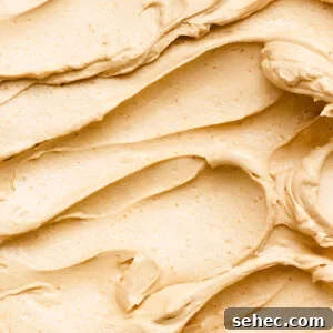 Brown Butter Buttercream Frosting Recipe 11 Close up of brown butter frosting smeared in a bowl.