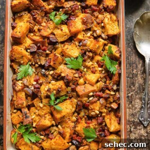 Chorizo and Fig Stuffing Recipe for Thanksgiving 5 Top down shot of chorizo stuffing in a baking dish topped with fresh parsley