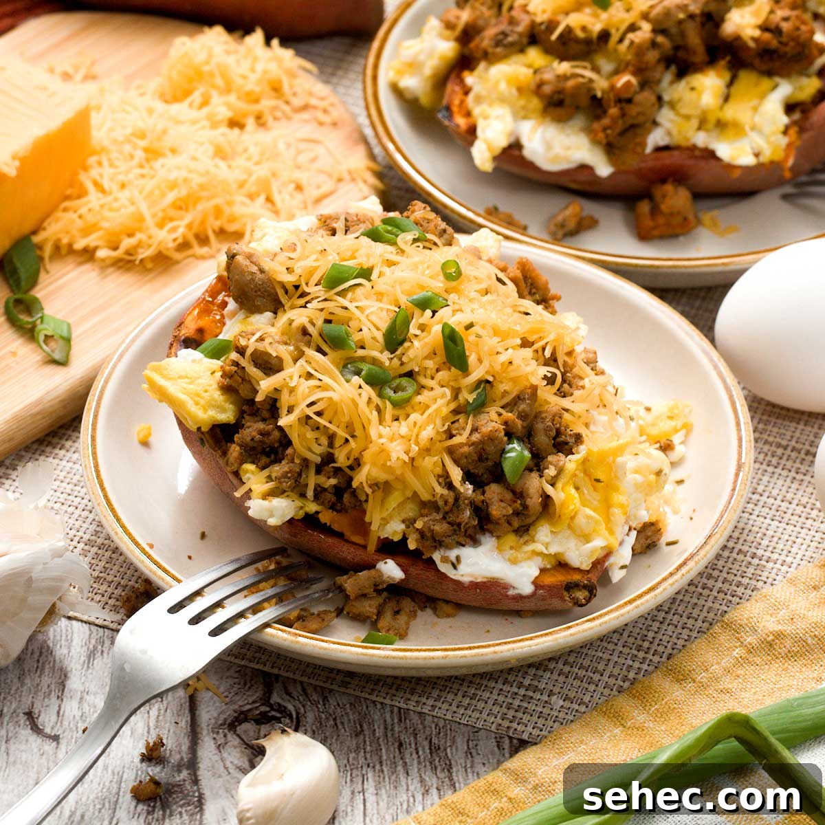 High Protein Loaded Baked Sweet Potato Breakfast 2 A loaded high-protein sweet potato with egg, ground turkey sausage, cheddar cheese, and chives.