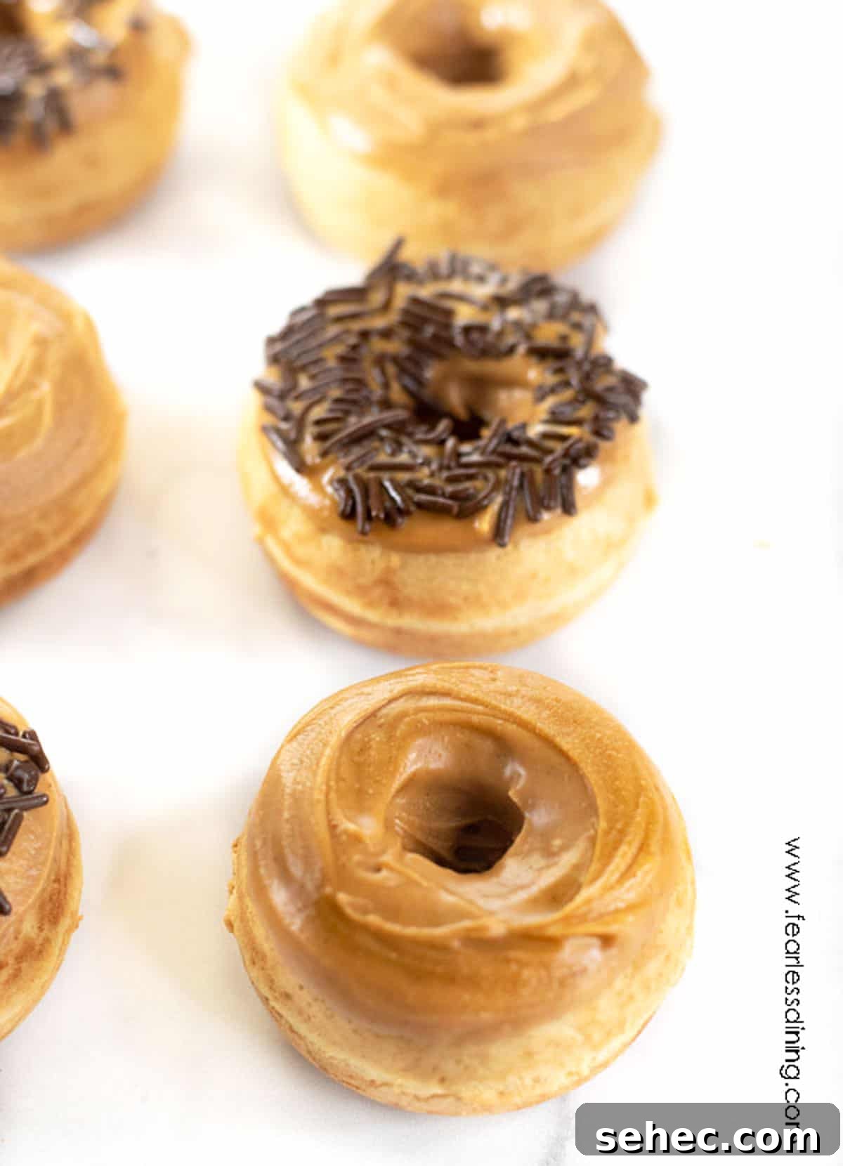 Gluten-Free Peanut Butter Donuts Recipe 2 Two rows of peanut butter donuts.