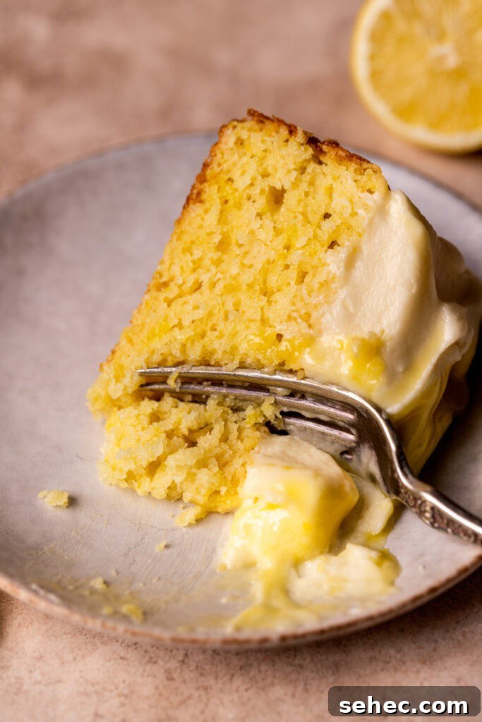 Lemon Curd Cake with a Soft Buttery Crumb 12 One slice of lemon curd cake on its side.