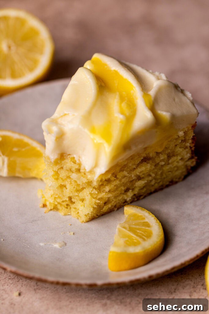 Lemon Curd Cake with a Soft Buttery Crumb 13 One slice of lemon curd cake on a plate.