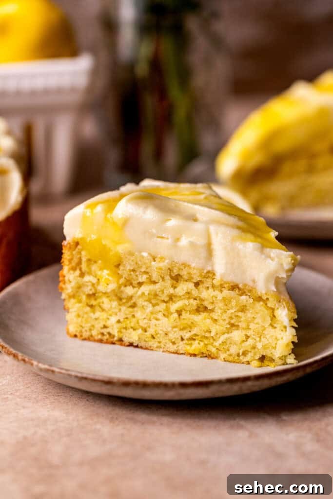 Lemon Curd Cake with a Soft Buttery Crumb 3 Slice of lemon curd cake on a plate.