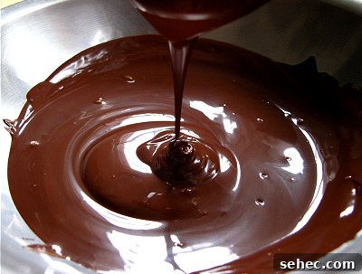 Rustic Single Layer Chocolate Cake Recipe 15 Chocolate ganache being poured