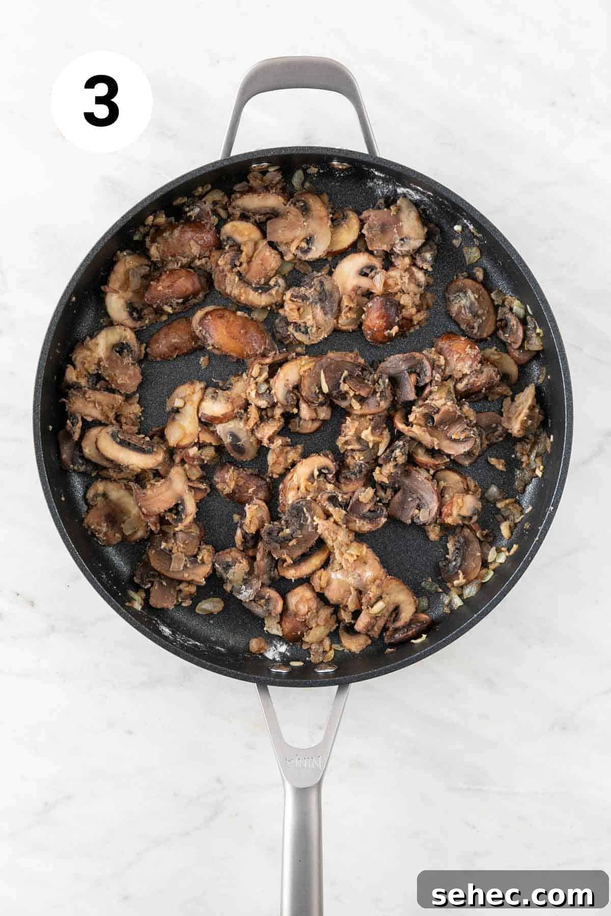 Vegan Mushroom Gravy Recipe 6 Onion, garlic, and mushrooms sautéed in a skillet with flour.