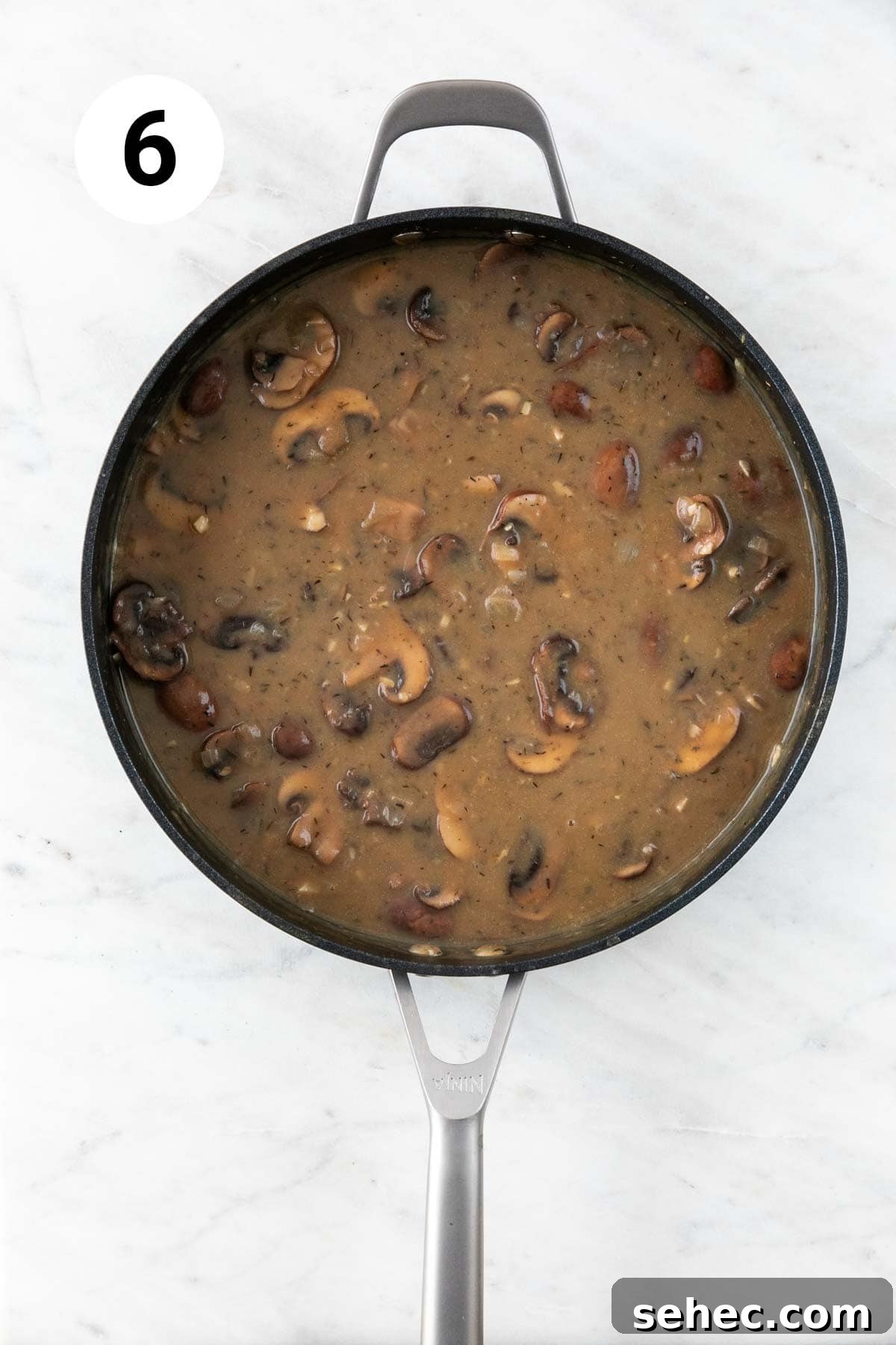 Vegan Mushroom Gravy Recipe 9 Vegan mushroom gravy in a skillet.