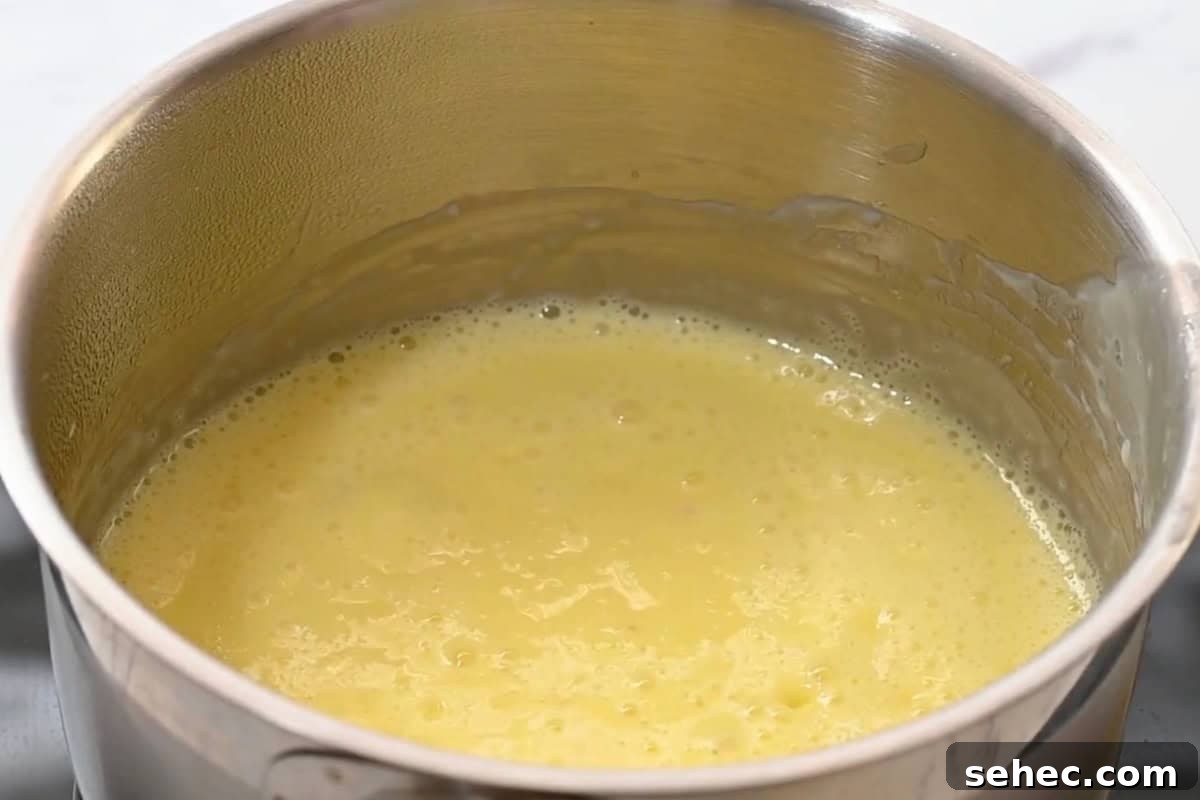 Boston Cream Pie Donuts with Chocolate Glaze 30 simmering pastry cream in a saucepan.