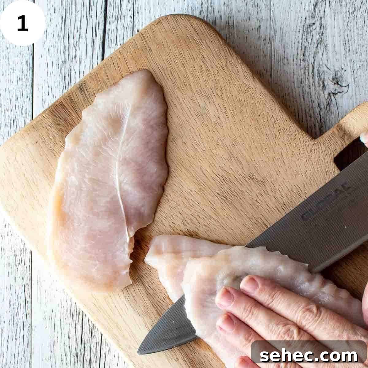 Chicken Saltimbocca with Prosciutto and Sage 4 Slicing chicken breast in half.