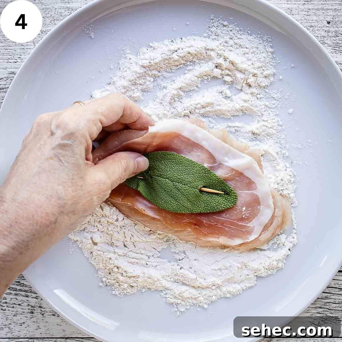 Chicken Saltimbocca with Prosciutto and Sage 7 Flouring a chicken cutlet that has prosciutto and a sage leaf secured on with a toothpick.