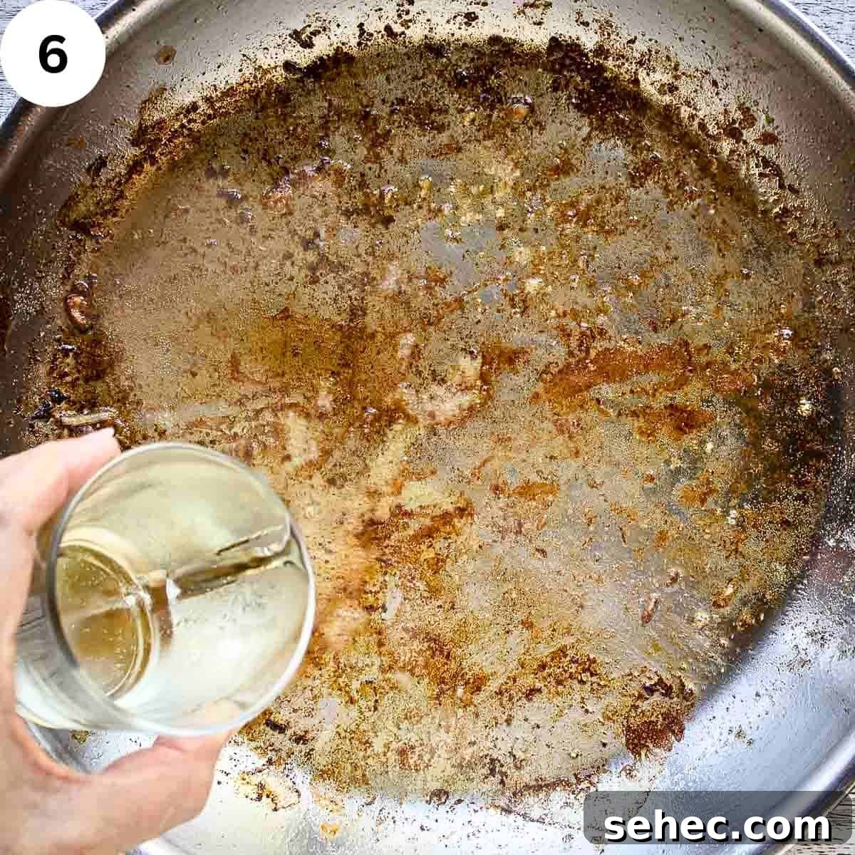 Chicken Saltimbocca with Prosciutto and Sage 9 Pouring white wine into a pan which has been used to fry and has browned bits.
