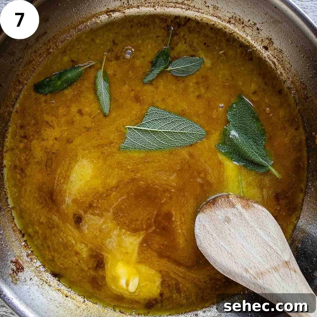 Chicken Saltimbocca with Prosciutto and Sage 10 Sage leaves and butter being stirred into a sauce in a frying pan.